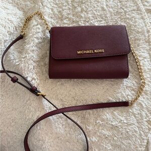 Michael Kors Burgendy Cross body wallet/bag like new!